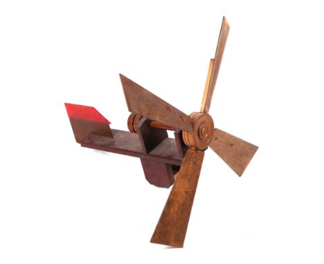 A scratch built wooden windmill weather vane, 63cms long.