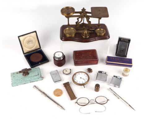 A set of brass postal scales; together with paperweights; medallions; silver plated decanter labels; watches and other items.