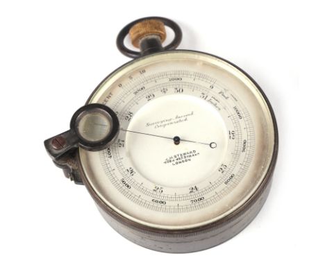 A surveying aneroid compensated pocket barometer, by J H Steward, 8cm diameter.Condition ReportThe needle moves with the plas