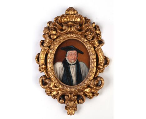 A 19th century oval portrait miniature on ivory, depicting William Land, Archbishop of Canterbury in an ornate gilt gesso fra