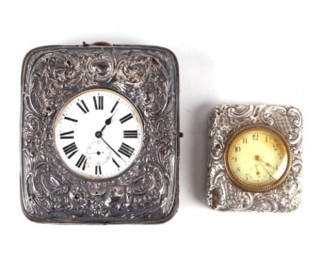 A Goliath type open faced pocket watch in a silver mounted leather stand, together with a silver mounted table clock, (2) 