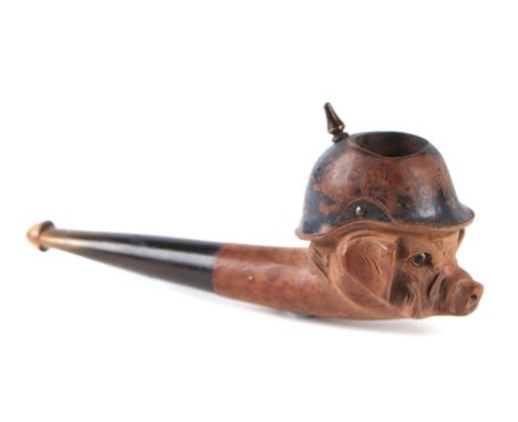 A World War I French carved walnut and horn propaganda caricature smoking pipe, modelled as a pig wearing a Pickelhaube helme