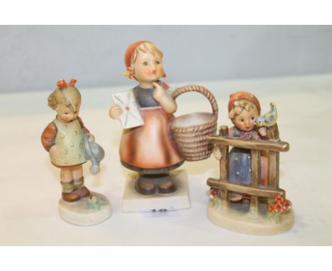 Three Goebel / Hummel figures to include girl watering flowers, girl with letter and girl at gate (3)