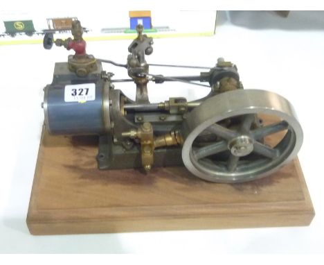 Stuart vertical model steam engine. 27cm long, 13cm high. On wooden plinth.