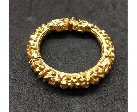 High Carat Indian Gold Bangle with dragon heads & gem set Eyes ..bangle  opens and is wax filled gold acid tested as high car