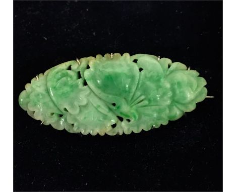 Vintage Carved Jade brooch set in white Metal measures approx 50mm by 22mm 