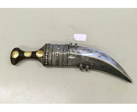 19th century Arab Jambiya Dagger with Rhino Handle Decorated with high carat Gold  coins in a silver Scabbard 