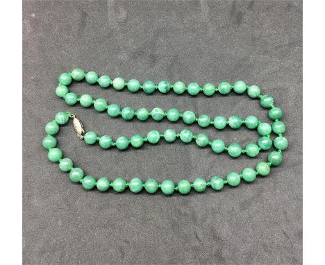 Vintage Round Jadeite Bead Necklace  with silver clasp measures approx 30ins long each bead approx 10mm dia 