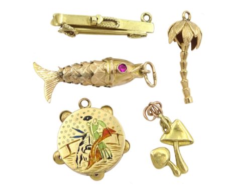 Three 18ct gold charms including tambourine with matador scene, mushroom and palm tree and two 14ct gold charms including an 