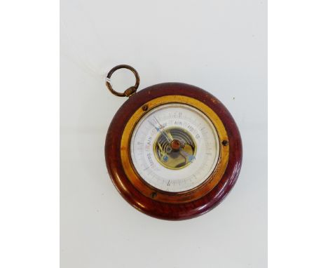 A miniature oak framed barometer, 9cm diameter