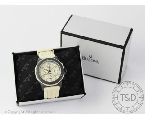 A Bulova Marine Star 100m chronograph wristwatch, the pewter coloured bezel enclosing cream dial with three subsidiary dials,