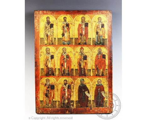 An Orthodox icon, 18th/19th century,  Oil on panel,  A three tiered icon depicting the twelve apostles within architectural a