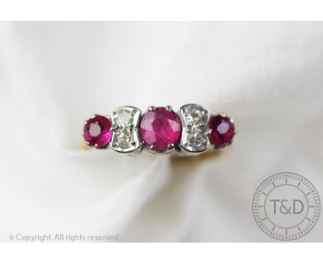 An untested ruby and diamond ring, the seven stone ring designed as three graduated rubies interspersed with four diamonds, a