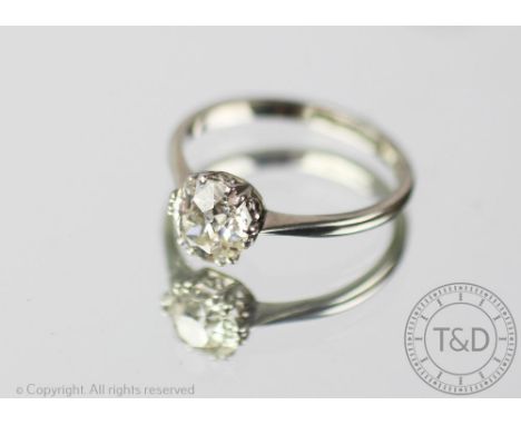 A diamond solitaire ring, the old brilliant cut diamond (measuring approximately 1.25ct), within a claw setting, to the taper