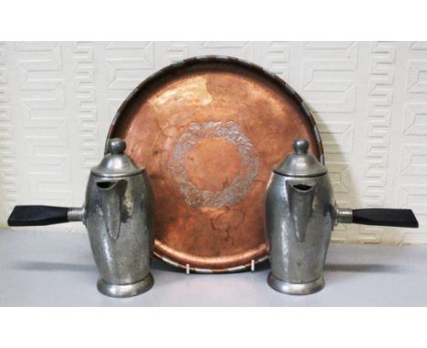 An Arts and Crafts copper and pewter circular tray by Hugh Wallis (1871-1943, Cheshire) decorated with a ring of roses in pew