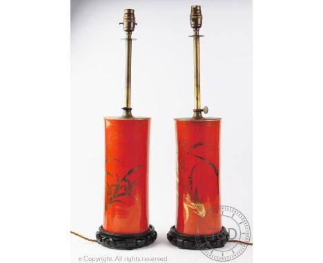 A pair of Japanese style adjustable cylindrical lamps, decorated with gilt flowers against an orange ground, 59cm high (2) CO