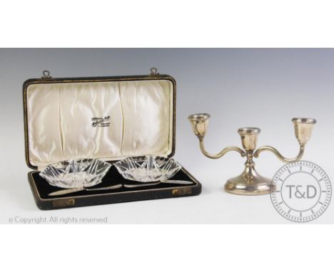 A silver short candelabra, Harrison Brothers &amp; Howson Ltd, Birmingham 1988, 21cm wide with a cased pair of cut glass butt