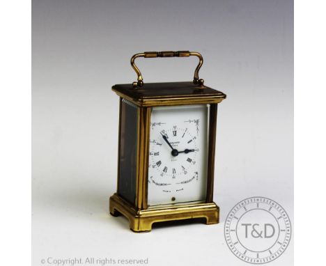 A French brass carriage time piece by Duverdrey & Bloquel, with Roman numeral dial marked 'Bayard, Paris' and eight day nine 