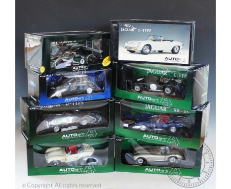 Eight boxed Auto Art 1:8 scale diecast model vehicles to include; Mini Cooper, Jaguar C-Type, Jaguar 120C, Jaguar C-Type, Ben