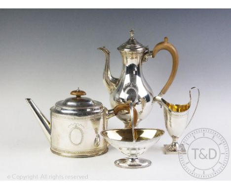 A George III style silver four piece tea and coffee service, C J Vander Ltd, London 1969, bearing vacant cartouche and gilt i