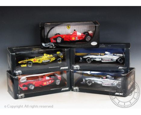 Five boxed Hotwheels Formula One racing car models, 1:18 scale, comprising; two Williams Formula One examples, Ralph Schumach