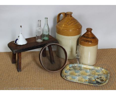 An early 20th century oak stool, 23cm H x 44cm W, two stoneware vessels named for Peter Walker &amp; Son Liverpool, and Jas S