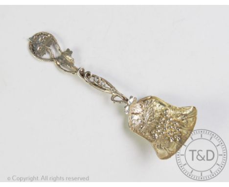 A silver caddy spoon, Hilliard &amp; Thomason, Birmingham 1928, the shovel shaped spoon with embossed grape bowl and vine lea