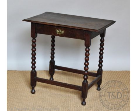 An 18th century and later oak side table, with drawer, on bobbin turned legs, 69cm H x 71cm W x 46cm D