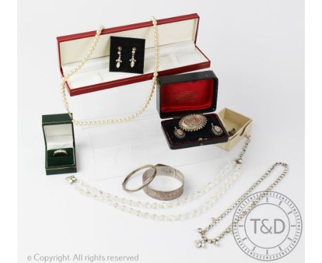 A selection of jewellery to include; a Victorian oval brooch and matching drop earrings, a silver belt or buckle bangle, Char