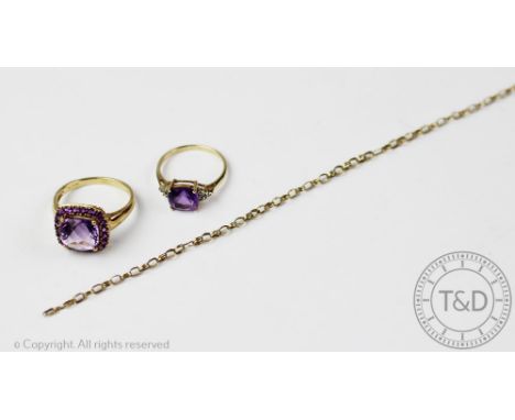 An amethyst and diamond set ring in 9ct gold, size N, with a further amethyst set dress ring in 9ct gold and a 9ct gold brace