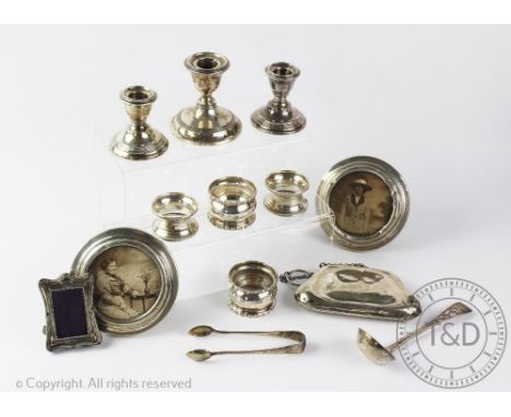 A selection of silver items to include a pair of silver photograph frames, C C May &amp; Sons, London 1918, each of circular 