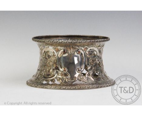 An early 19th century Old Sheffield Plate potato ring, the circular pierced and embossed ring bearing two vacant cartouche, f