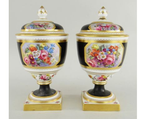 PAIR OF COPELAND'S SPODE CHINA URNS & COVERS painted with flowers by J Worrall, 20cms high (cracks, repairs)There are hairlin