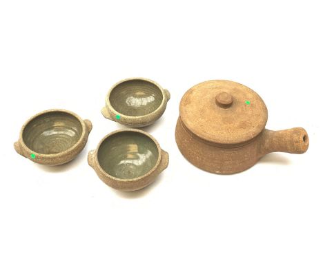 A Leach Pottery lidded casserole dish, including handle L25cm, together with three bowls, D14.5cm, each with impressed studio