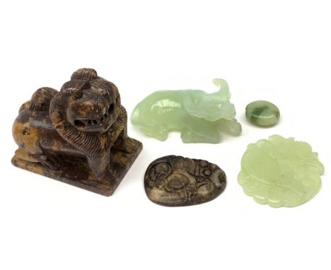 A Chinese carved celadon jade model of an Oxen in recumbent pose, 7.5cm, together with a celadon jade dish carved with a fish