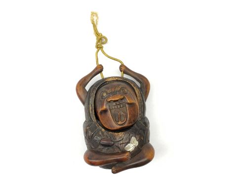 A Japanese carved soft wood inro, modelled as a streching and yawning figure, possibly Daruma, detailed with insect, inset mo