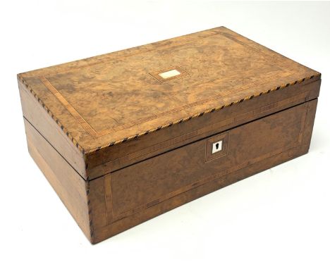 A late 19th century walnut writing slope, with inlaid borders and central mother of pearl plaque to the hinged cover, opening