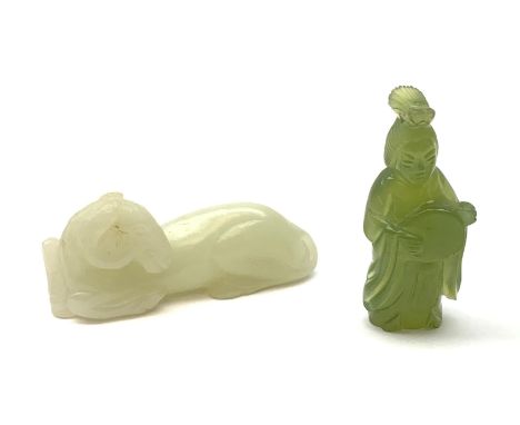 A Chinese celadon jade carved figure, modelled as a recumbent horse, L6cm, together with a nephite jade carved figure modelle