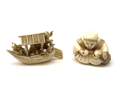 A Japanese carved ivory Netsuke, modelled as a seated figure with monkey companion, signed beneath, H3.5cm, together with a c