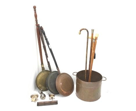 A collection of four walking canes, to include a bone handled example upon Malacca cane, and another marked Royal Army Medica