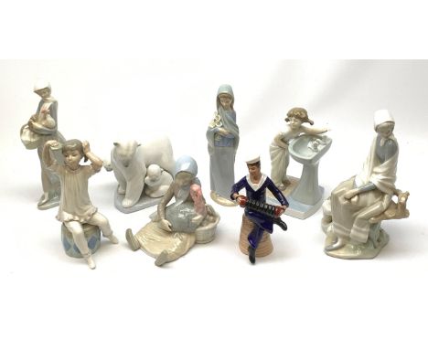 A mid 20th century Dresden porcelain figurine, modelled as a sailor playing an accordion, H16.5cm, together with a collection