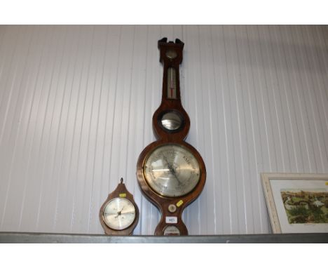 A mahogany cased thermometer / barometer together with a barometer