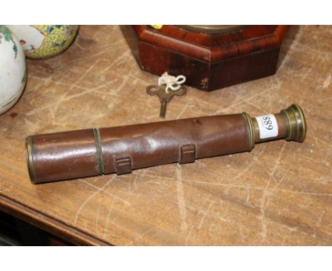 A Britannic leather and brass telescope