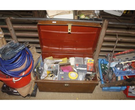A metal dome topped trunk and contents to include various tools, door latches, assorted fixings, metal brackets etc.