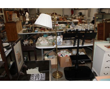 A brass standard lamp and shade