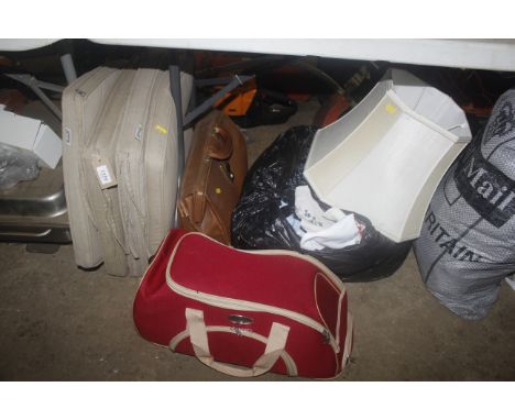 Four garden chair cushions; a sports holdall; a briefcase; a lampshade; a quantity of various linen etc.