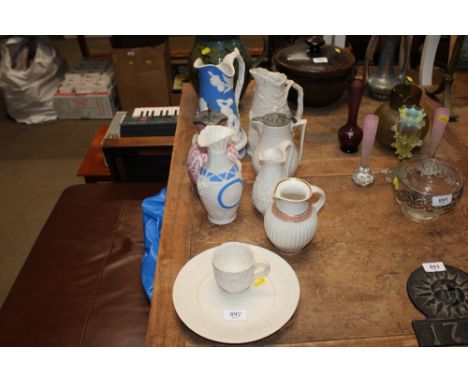 A collection of Parian jugs; two having pewter lids, a Royal Worcester Parian plate etc.