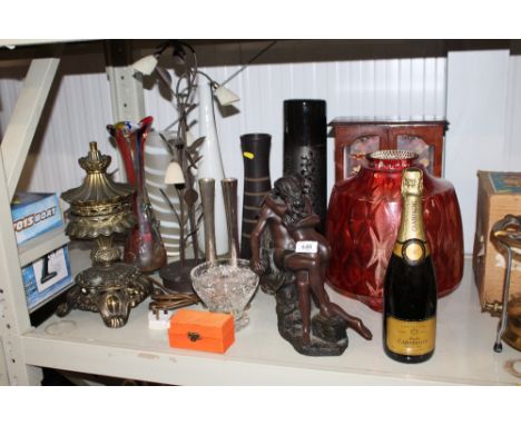 An Art Glass vase; a brass oil lamp converted to electricity; a resin Art Deco figure; a jewellery cabinet; a bottle of Champ
