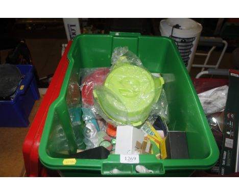 A plastic crate containing various items to include rollers; plastic water bowls; webcams; DVDs; nail drill kit; carbon monox