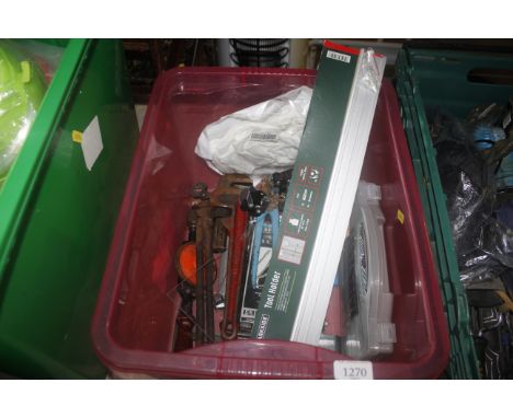 A box containing various tools to include a wall mounting tool holder; hand drill; pipe wrench; assorted screws etc.